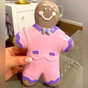 Cute ginger bread decoration it’s light pink lavender brown white and grey!